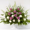 Flowers Included:

White Carnations
White Larkspur
Purple Roses
Seasonal Greens
 

 

Substitutions may be necessary to