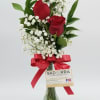 A beautiful array of Three Red Roses arranged in a Bud Vase