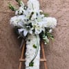 Funeral cross spray with all white fresh flowers and accents