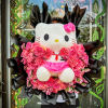 This charming bouquet combines soft blush pink and peach roses with a
