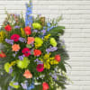 A beautiful arrangement of bright and colorful flowers in a standing spray