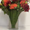Lush assortment of long stemmed flowers set in a cluster of steel