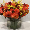 Lush assortment of long stemmed flowers set in a cluster of steel
