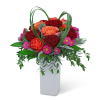 The vibrant colors in this arrangement are sure to brighten up any