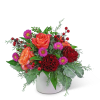 The vibrant colors in this arrangement are sure to brighten up any