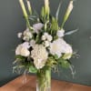 Tall beautiful white floral arrangement, filled with calla lilies, hydrangea, roses, casa