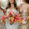 - Vibrant bridal bouquet bursting with a colorful array of garden flowers
-