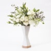 An arrangement of white in a handmade ceramic angular white vase. Vase