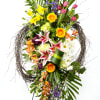 Each spray contains circles of grapevine intertwined with tulips, iris, daffodils, lilies