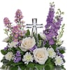 This beautiful piece includes cr&egrave;me roses, lavender larkspur, lavender montecasino asters, white