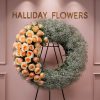 A 24-inch funeral wreath, exquisitely designed with delicate baby&#039;s breath and 