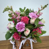 This enchanting pot arrangement features a delicate blend of white and pink