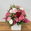 &quot;Square of Blossoms&quot; features a white vase filled with light pink, white