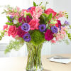 Roses and snapdragons add gorgeous texture to complement the blooms in this