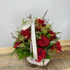  This arrangement of deep red roses nestled in a white basket