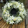 Large Wreath on easel, all white contemporary and a dedication to the