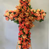 This cross is covered in orange roses and orchids.

We include easel, printed