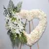 The white heart is made up of white roses, stargazer lilies and