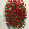 Simple and elegant, this sympathy spray features red roses surrounded by seasonal