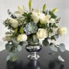 This beautiful arrangement combines the purity of lilies with the glamour of