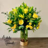 Brighten up any room with this vibrant arrangement of yellow Lilies and