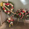 Pink roses, lavender roses, pink carnations, peach carnations, orange gerber daisies, solidago