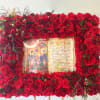 This frame includes a mix of roses and seasonal greens. Frames are