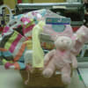 Beautifully decorated and fun to receive baby gift basket filled with gifts