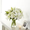 This elegant vessel filled with lovely white hydrangea and White oriental lilies.