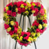 Open heart with clusters of roses, orchids, hydrangea, and ti leaves. Accentuated