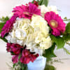 A Gathering of white and hot pink flowers creates a striking contrast.