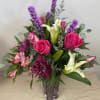 A gorgeous collection of fragrant favorites-Lilies and roses accented with a lovely