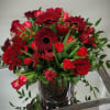 Classice arrangment of mixed blooms in red. Sure to touch a heart.