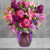 Like a rare jewel, this regal arrangement of lavender roses and pink
