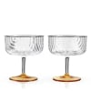Draping glass and polished gold details give this stemmed glassware set Jazz