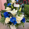 Perfect funeral arrangement for him  with roses and lylis 