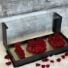 Indulge her with this fancy acrylic box holding 30 roses. 