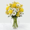 A beautiful sunny arrangement of yellow roses and white daisies