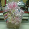 Beautifully decorated and fun to receive baby gift basket filled with gifts