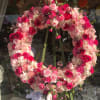 Abundance of fresh blooms in a beautiful easel arrangement.
