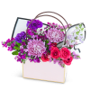 The Serene Love Blooms Tote is a beautifully crafted flower arrangement, showcasing