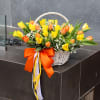 Basket with orange and yellow tulips