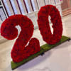 Delicately handcrafted floral design made with roses and seasonal floral. 2D Design