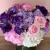 This beautiful flower arrangement is made with pink and white Hydrangeas, pink