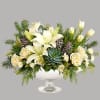 Simply unique, this gorgeous green and winter-white design is artfully hand-arranged in