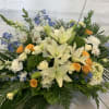 pure white and pastel blue, yellow and greens. Lilies  and roses
