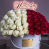 A stunning arrangement of flowers featuring  pristine red and white roses