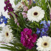 The sublime beauty of twilight is captured in flowers. Our garden-inspired arrangement
