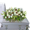 Our Unforgettable Casket Spray is a beautiful arrangement featuring roses, carnations, hydrangeas