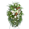 Our Unforgettable Standing Spray is a beautiful arrangement featuring roses, carnations, lilies